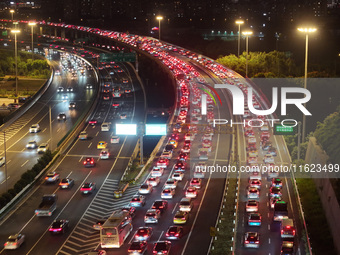 A photo taken on September 30, 2024, shows congestion on several expressways during the National Day holiday in Nanjing, China. (