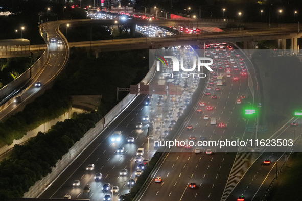 A photo taken on September 30, 2024, shows congestion on several expressways during the National Day holiday in Nanjing, China. 