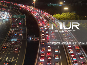 A photo taken on September 30, 2024, shows congestion on several expressways during the National Day holiday in Nanjing, China. (