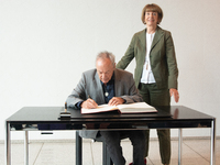 Actor Udo Kier greets Cologne Mayor Henriette Reker for his 80th birthday and signs the Golden Book at Cologne Town Hall in Cologne, Germany...