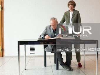 Actor Udo Kier greets Cologne Mayor Henriette Reker for his 80th birthday and signs the Golden Book at Cologne Town Hall in Cologne, Germany...