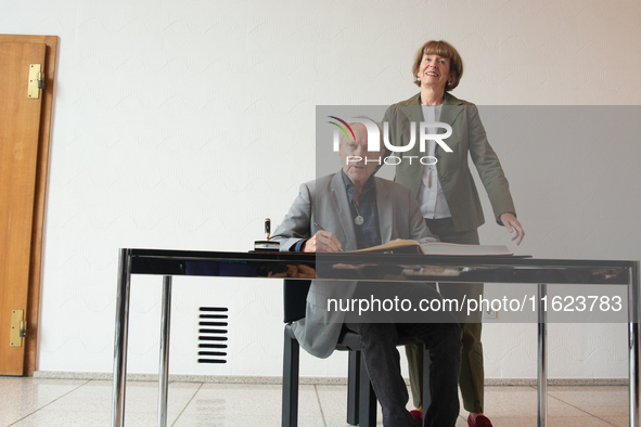 Actor Udo Kier greets Cologne Mayor Henriette Reker for his 80th birthday and signs the Golden Book at Cologne Town Hall in Cologne, Germany...