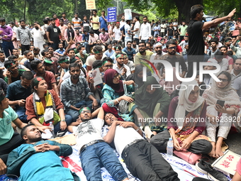 Job seekers stage a demonstration on the road in front of the chief adviser's residence, Jamuna, demanding to raise the age limit for govern...