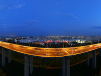 Traffic flows for several kilometers past the G15 Shenyang-Haikou Expressway of the Sutong Yangtze River Bridge in Changshu, China, on Septe...