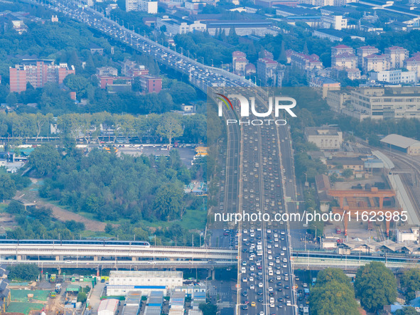 A photo taken in Nanjing, China, on September 30, 2024, shows the traffic flow on the elevated road in the south of Nanjing City, Jiangsu Pr...