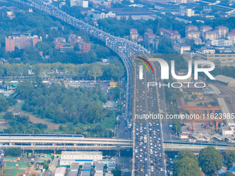 A photo taken in Nanjing, China, on September 30, 2024, shows the traffic flow on the elevated road in the south of Nanjing City, Jiangsu Pr...