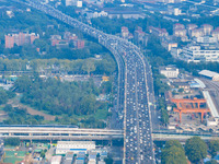 A photo taken in Nanjing, China, on September 30, 2024, shows the traffic flow on the elevated road in the south of Nanjing City, Jiangsu Pr...