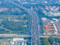 A photo taken in Nanjing, China, on September 30, 2024, shows the traffic flow on the elevated road in the south of Nanjing City, Jiangsu Pr...