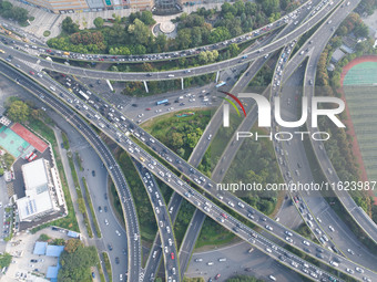 A photo taken in Nanjing, China, on September 30, 2024, shows the traffic flow on the elevated road in the south of Nanjing City, Jiangsu Pr...