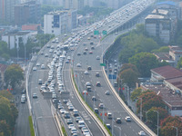 A photo taken in Nanjing, China, on September 30, 2024, shows the traffic flow on the elevated road in the south of Nanjing City, Jiangsu Pr...