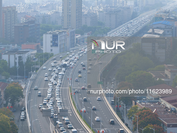 A photo taken in Nanjing, China, on September 30, 2024, shows the traffic flow on the elevated road in the south of Nanjing City, Jiangsu Pr...