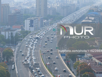 A photo taken in Nanjing, China, on September 30, 2024, shows the traffic flow on the elevated road in the south of Nanjing City, Jiangsu Pr...