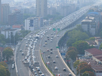 A photo taken in Nanjing, China, on September 30, 2024, shows the traffic flow on the elevated road in the south of Nanjing City, Jiangsu Pr...