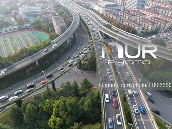 A photo taken in Nanjing, China, on September 30, 2024, shows the traffic flow on the elevated road in the south of Nanjing City, Jiangsu Pr...