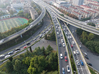 A photo taken in Nanjing, China, on September 30, 2024, shows the traffic flow on the elevated road in the south of Nanjing City, Jiangsu Pr...