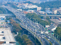 A photo taken in Nanjing, China, on September 30, 2024, shows the traffic flow on the elevated road in the south of Nanjing City, Jiangsu Pr...