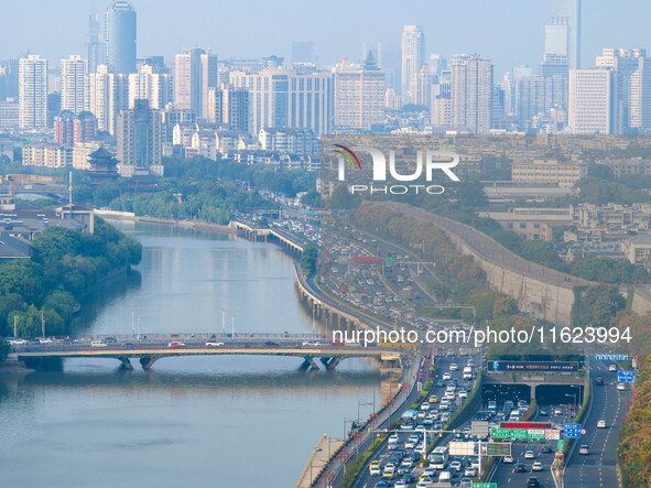 A photo taken in Nanjing, China, on September 30, 2024, shows the traffic flow on the elevated road in the south of Nanjing City, Jiangsu Pr...