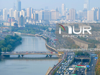 A photo taken in Nanjing, China, on September 30, 2024, shows the traffic flow on the elevated road in the south of Nanjing City, Jiangsu Pr...