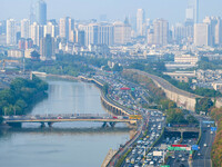 A photo taken in Nanjing, China, on September 30, 2024, shows the traffic flow on the elevated road in the south of Nanjing City, Jiangsu Pr...