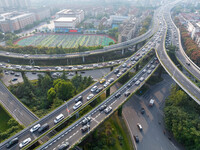 A photo taken in Nanjing, China, on September 30, 2024, shows the traffic flow on the elevated road in the south of Nanjing City, Jiangsu Pr...