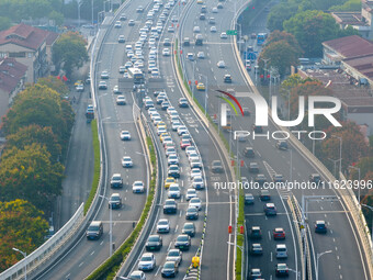 A photo taken in Nanjing, China, on September 30, 2024, shows the traffic flow on the elevated road in the south of Nanjing City, Jiangsu Pr...