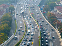 A photo taken in Nanjing, China, on September 30, 2024, shows the traffic flow on the elevated road in the south of Nanjing City, Jiangsu Pr...