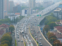 A photo taken in Nanjing, China, on September 30, 2024, shows the traffic flow on the elevated road in the south of Nanjing City, Jiangsu Pr...