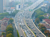 A photo taken in Nanjing, China, on September 30, 2024, shows the traffic flow on the elevated road in the south of Nanjing City, Jiangsu Pr...