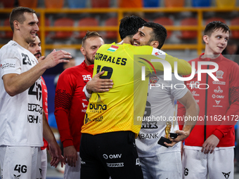 Mohamed Yehia Elderaa celebrates with a teammate after the IHF Men's Handball Club World Championship 2024 preliminary round match between V...