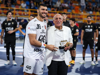 Hussen Labib, chairman of the board of directors of Zamalek, delivers the Man of the Match award to Mohamed Yehia Elderaa of Veszprem HC aft...