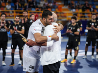 Hussen Labib, chairman of the board of directors of Zamalek, delivers the Man of the Match award to Mohamed Yehia Elderaa of Veszprem HC aft...