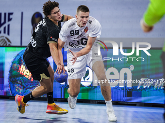 99 Mark Kosorotov of Veszprem HC battles for the ball with 8 Ziad Hashad of Zamalek Club during the IHF Men's Handball Club World Championsh...