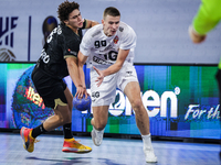 99 Mark Kosorotov of Veszprem HC battles for the ball with 8 Ziad Hashad of Zamalek Club during the IHF Men's Handball Club World Championsh...