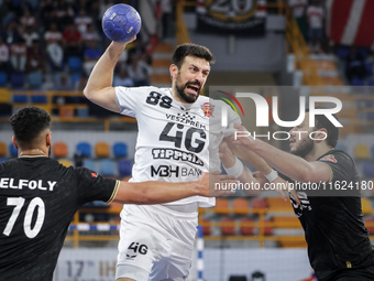 Agustin Casado Marcelo of Veszprem HC battles for the ball with Mohamed Abo Saleem of Zamalek Club during the IHF Men's Handball Club World...