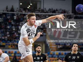 Mikita Vailupau of Veszprem HC participates in the IHF Men's Handball Club World Championship 2024 preliminary round match between Veszprem...