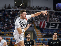 Mikita Vailupau of Veszprem HC participates in the IHF Men's Handball Club World Championship 2024 preliminary round match between Veszprem...