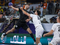 Nedim Remili of Veszprem HC battles for the ball with Omar Sadek of Zamalek Club during the IHF Men's Handball Club World Championship 2024...