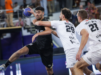 Nedim Remili of Veszprem HC battles for the ball with Omar Sadek of Zamalek Club during the IHF Men's Handball Club World Championship 2024...