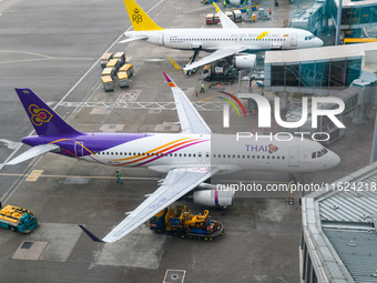 An Airbus A320-232 of Thai Airways is seen at the gate of the Hong Kong International Airport in Hong Kong, China, on September 23, 2024. (