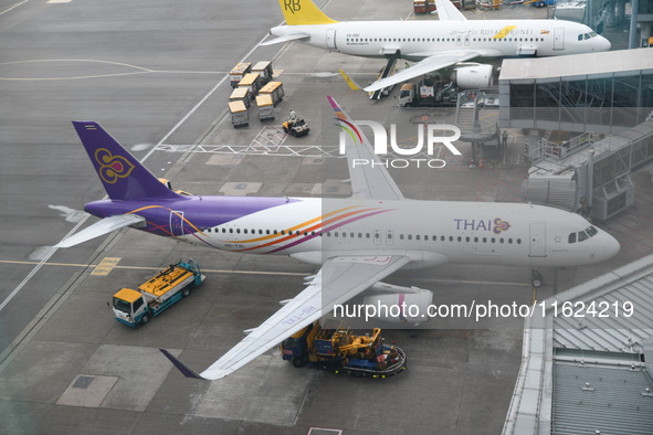 An Airbus A320-232 of Thai Airways is seen at the gate of the Hong Kong International Airport in Hong Kong, China, on September 23, 2024. 