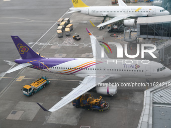 An Airbus A320-232 of Thai Airways is seen at the gate of the Hong Kong International Airport in Hong Kong, China, on September 23, 2024. (