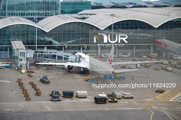 A Boeing 787-9 of Japan Airlines is parked at a gate of the Hong Kong International Airport in Hong Kong, China, on September 23, 2024. 