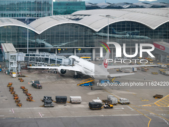 A Boeing 787-9 of Japan Airlines is parked at a gate of the Hong Kong International Airport in Hong Kong, China, on September 23, 2024. (