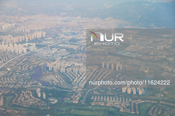 Building rows are seen from a plane on approach to Chongqing, China, on September 23, 2024. 