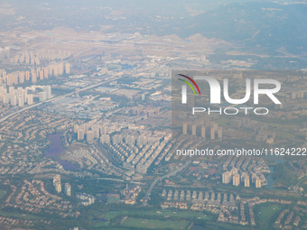 Building rows are seen from a plane on approach to Chongqing, China, on September 23, 2024. (