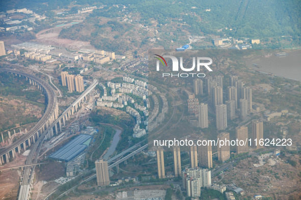 Building rows are seen from a plane on approach to Chongqing, China, on September 23, 2024. 