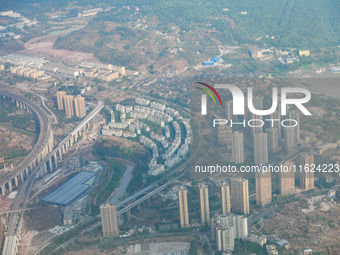 Building rows are seen from a plane on approach to Chongqing, China, on September 23, 2024. (