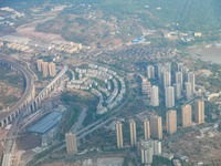 Building rows are seen from a plane on approach to Chongqing, China, on September 23, 2024. (