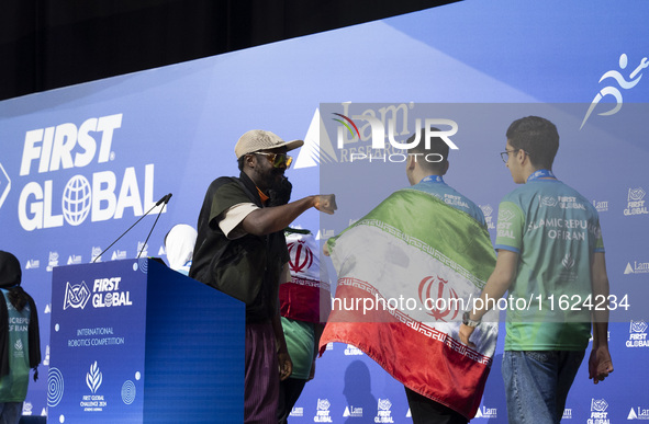 Will.i.am, frontman of the Black Eyed Peas, presents medals during the FIRST Global Challenge 2024, the ''Olympics'' of Robotics, in Athens,...