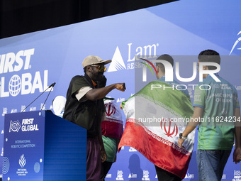 Will.i.am, frontman of the Black Eyed Peas, presents medals during the FIRST Global Challenge 2024, the ''Olympics'' of Robotics, in Athens,...